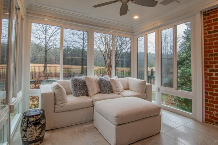 white-sofa-near-glass-window-3773574